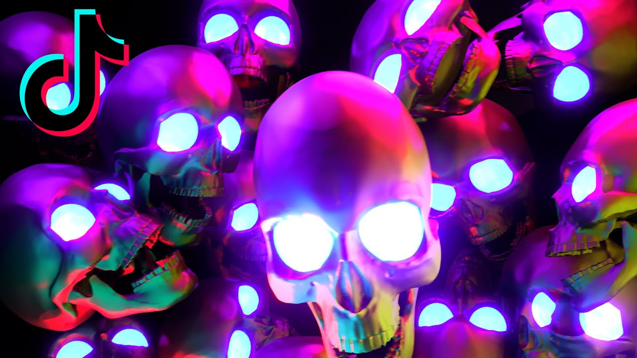 neon skulls with glowing eyes halloween 4k Tiktok Background/wallpaper