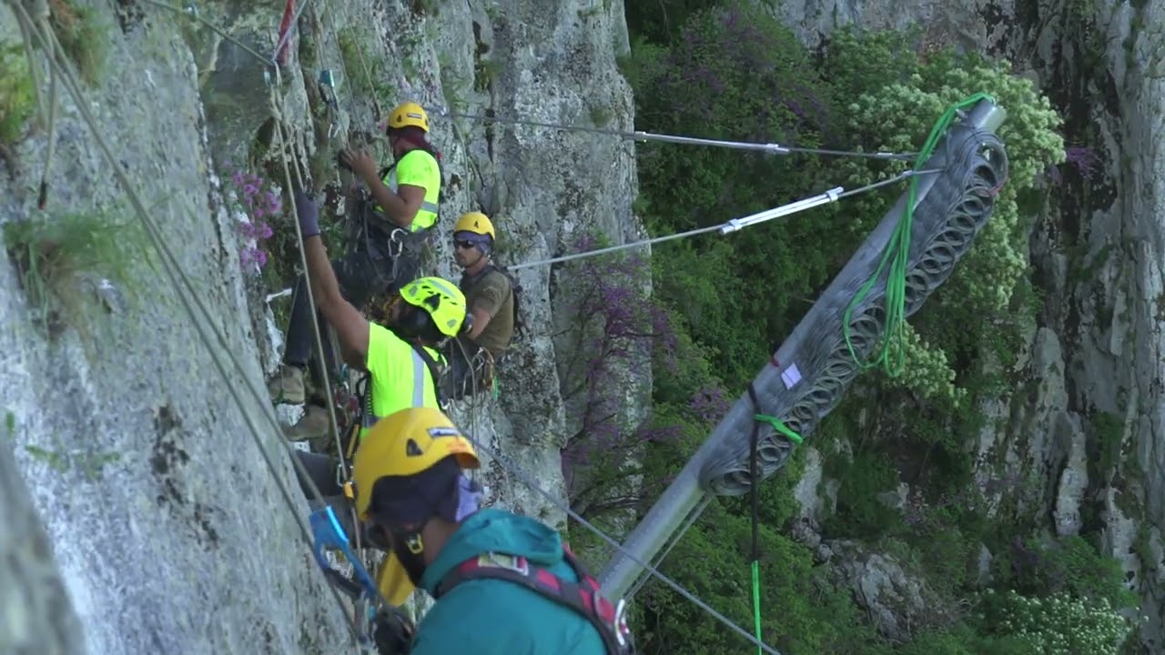 Rockfall barrier instalation with helicopter at the Theopetra cave of Trikala