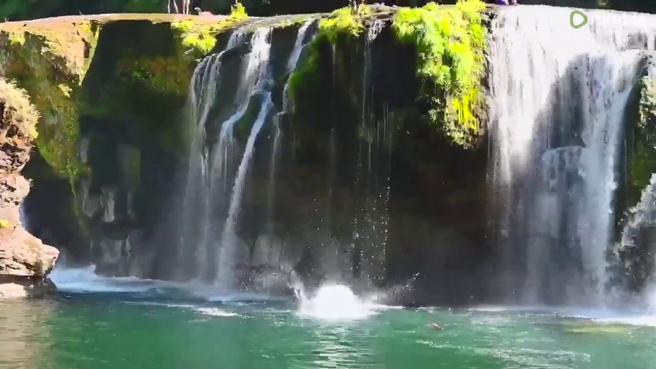 Epic cliff dive from stunning Washington waterfall