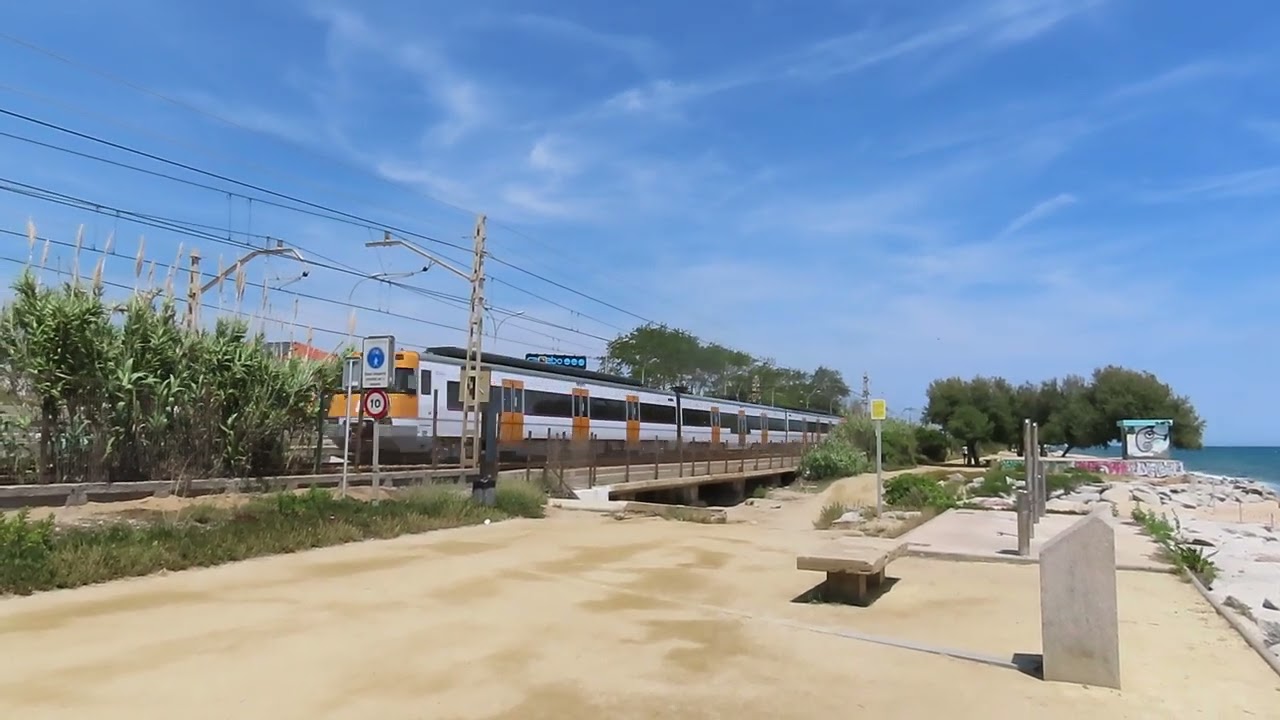 Spain: Barcelona bound Rodalies de Catalunya near Ocata (east of Barcelona) 06/06/24