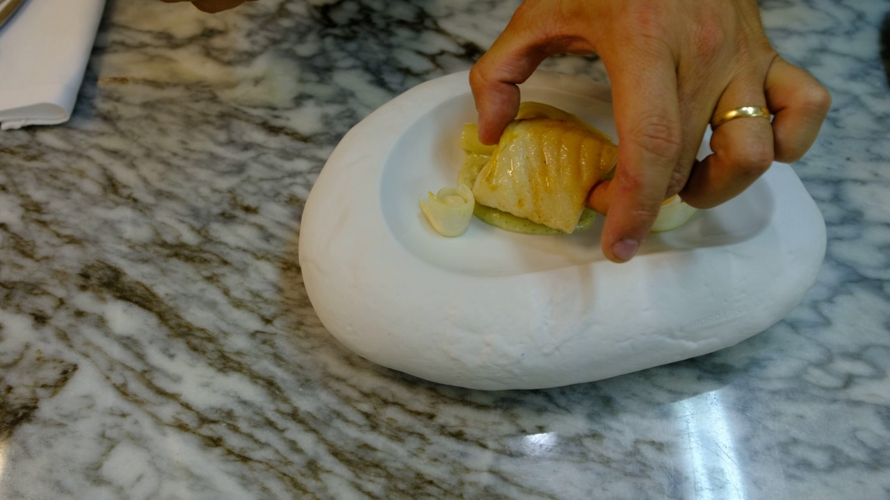 João Oliveira prepares a starter with John Dory fish at Vista Restaurante
