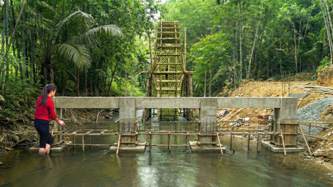 Building Barriers To Protect The Water Wheel System Before Storm Season