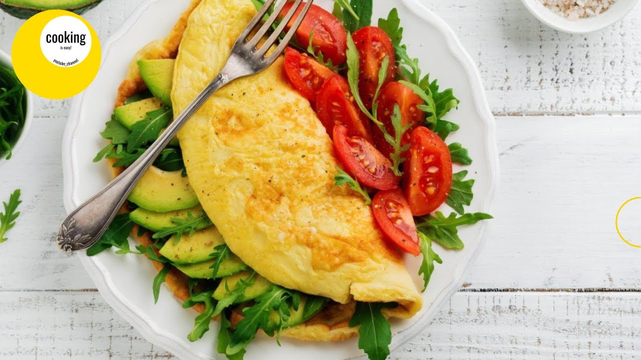 Omelet with tomatoes, cheese and avocado. A simple and delicious recipe for breakfast