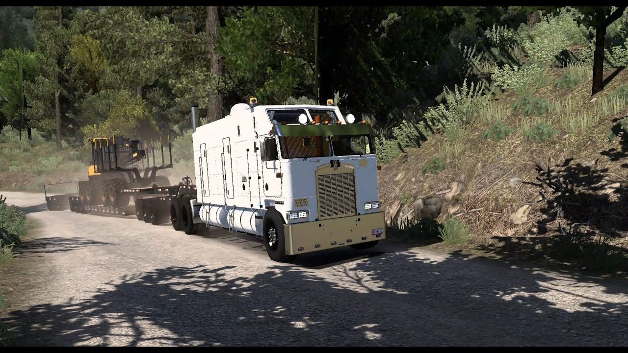 Truck: K100E Long. Trailer: Triple Lowboy. Carga: Cargador forestal - ATS 2026 01 22 00 30 33