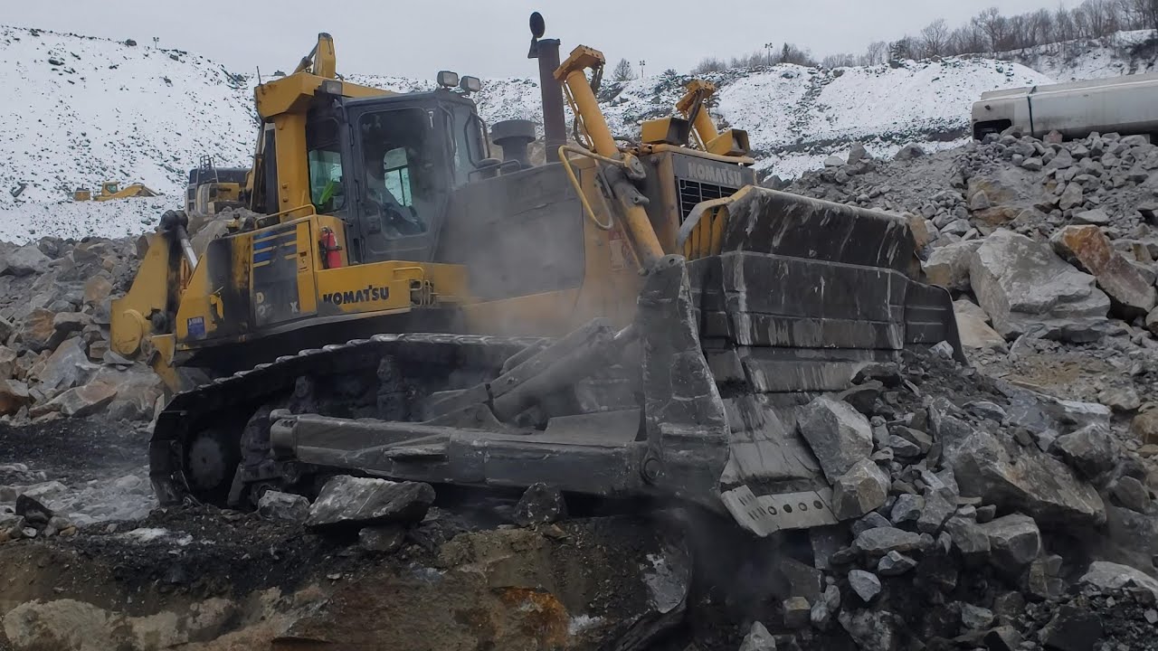 Komatsu D275AX and Cat 777s Backfilling