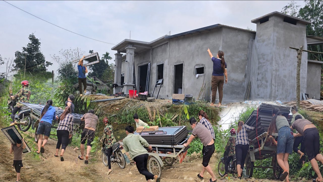 Transporting a batch of large doors across challenging terrain.