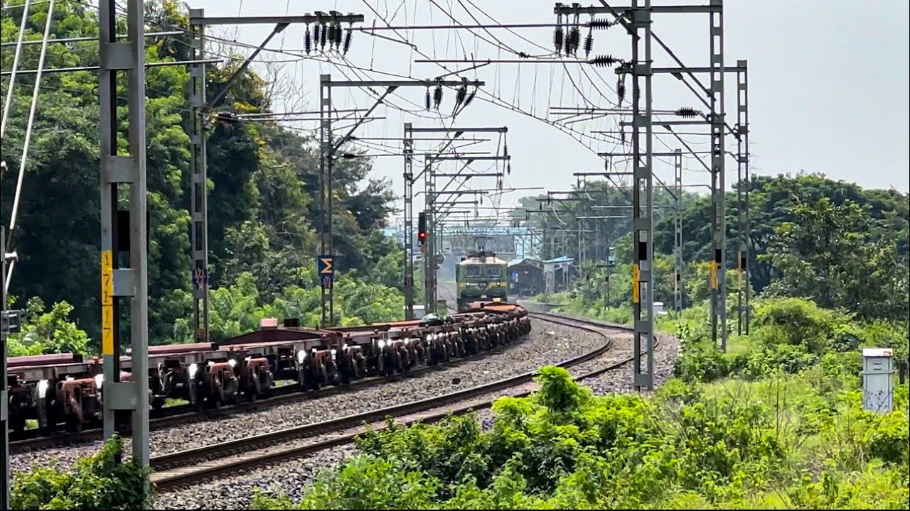 KJM WAG 9HC #32961 with Flat bed freight skipping akurdi railway station.
