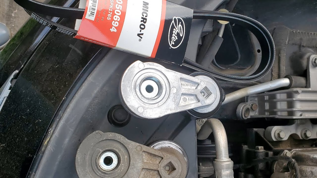 Mobile Repair 2012 chevy impala belt tensioner and drive belt replacement.