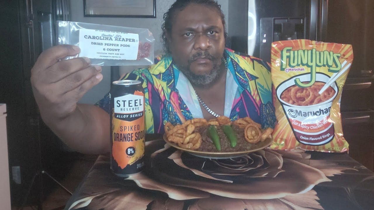 CAROLINA REAPER CHILI A BAG OF FUNYUNS SPICY CHICKEN RAMEN FLAVOR AND A CAN OF STEEL RESERVE ORANGE
