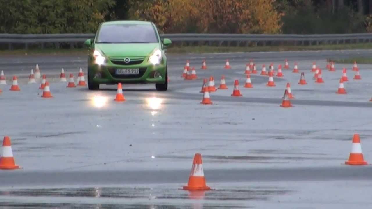 Opel Corsa OPC N&uuml;rburgring Edition on test track and Opel Astra OPC on steep turn