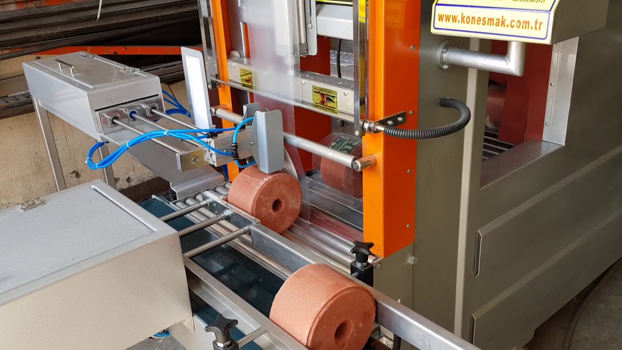 KONESMAK TAM OTOMATİK TEKLİ YALAMA TAŞI ETİKET KOYMALI ŞHRİNK AMBALAJ MAKİNASI