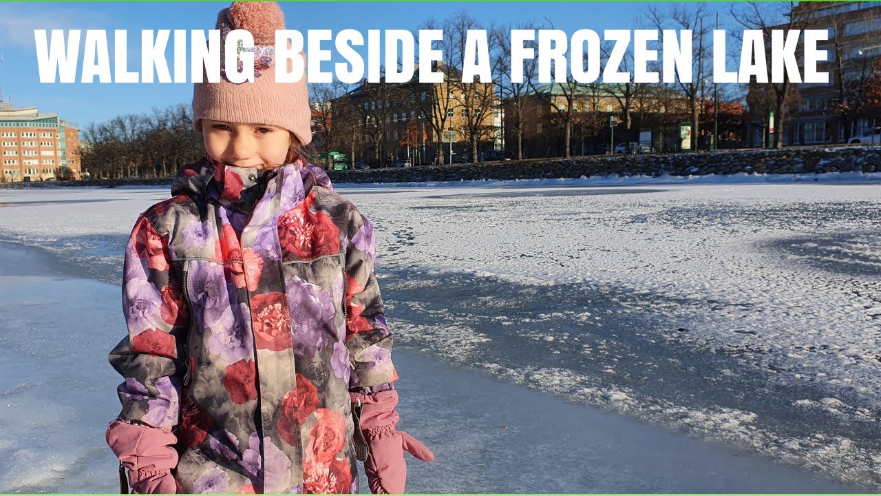 WALKING  BESIDE  A FROZEN LAKE