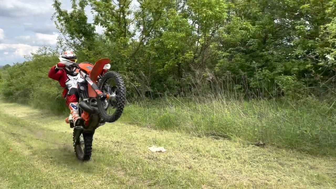 A quick power wheelie uphill on KTM EXC 250 with wheeliemate wheelie trainer.