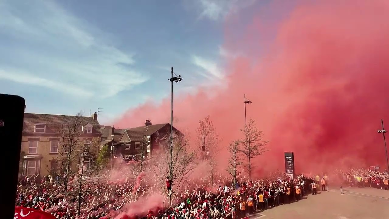 Liverpool fans celebrate as team bus arrives at Anfield ahead of Tottenham game