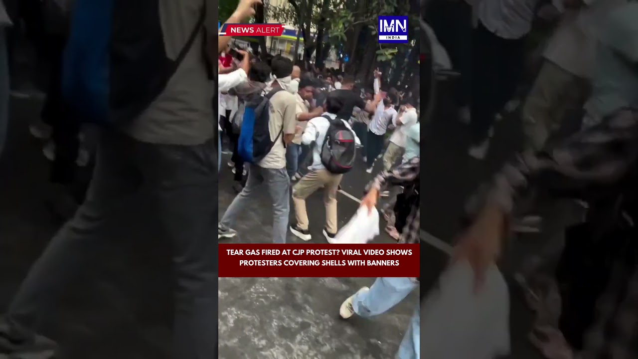 Tear Gas Fired at CJP Protest Viral Video Shows Protesters Covering Shells with Banners #viralnews