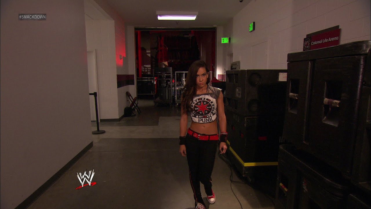 Moments after Matt Striker interviews Kane, we see AJ looking on: SmackDown, June 8, 2012