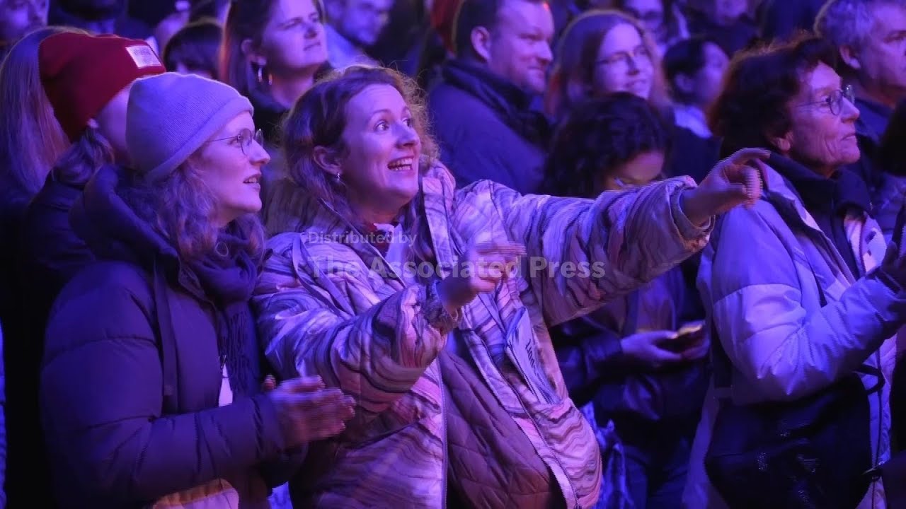 Crowds cheer Winter Olympics opening ceremony from fanzone in Milan