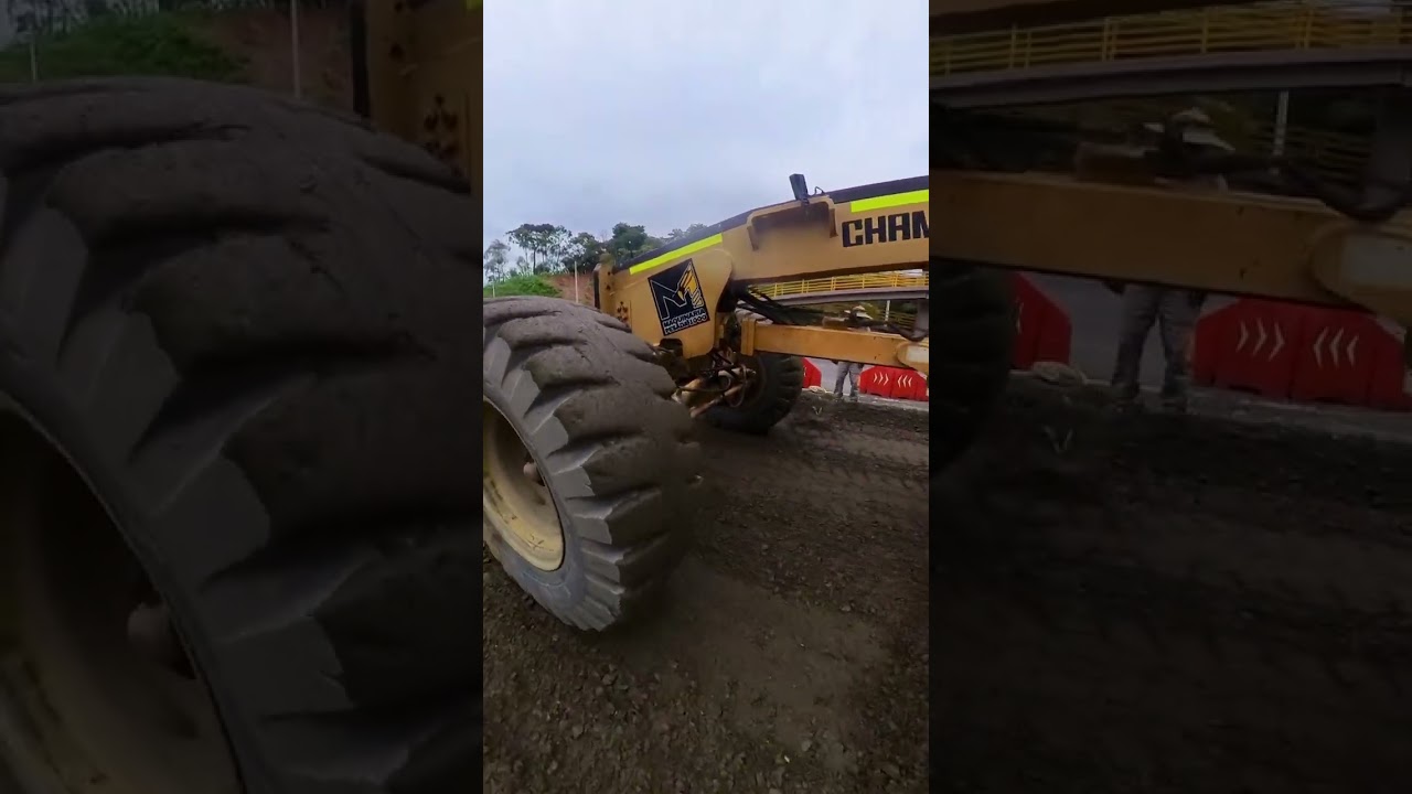 motoniveladora trabajando con niveles o topografia ceriando base granular para pavimento