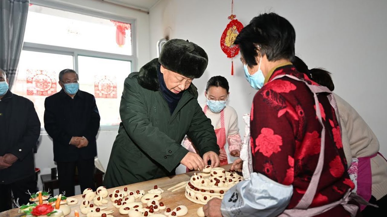 Chinese President Xi Jinping visits villagers in snowy valley
