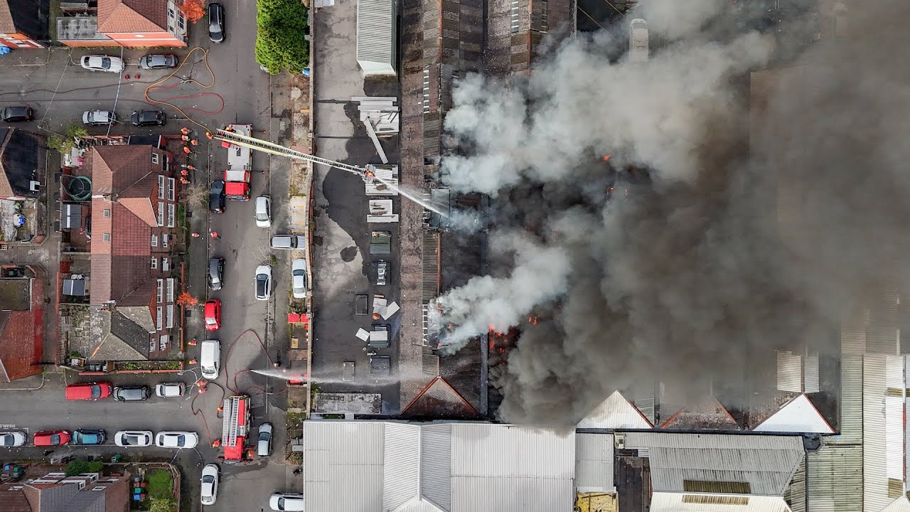 Drone video reveals smoke billowing across city centre after a huge fire broke out | SWNS