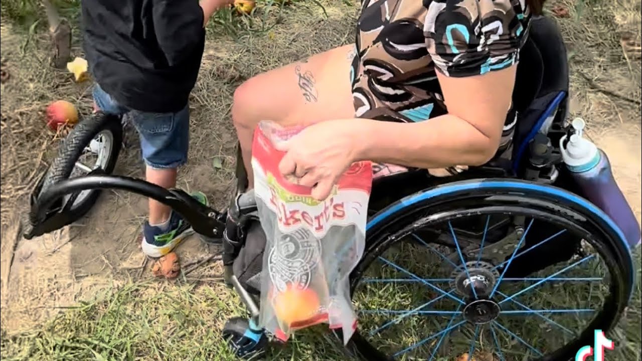 Picking apples on the farm in my wheelchair