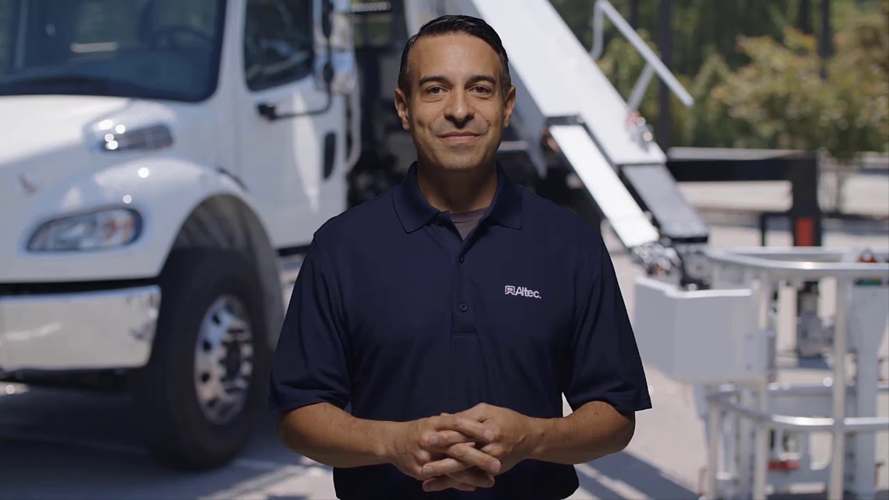 How to perform a pre-operational inspection on the Altec LS60 aerial unit?