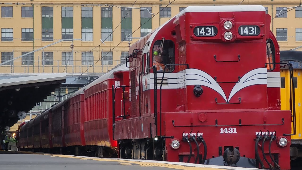 64-year-old EMD G12 locomotive leaving Wellington station with its empty carriage set
