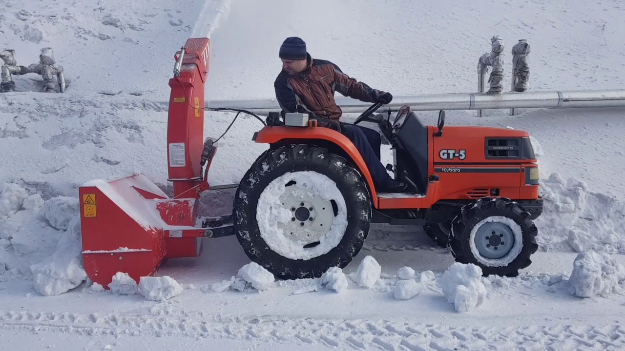 Шнекоротор Снег-1250 и Kubota GT-5. Уборка сперсованного снега и льда