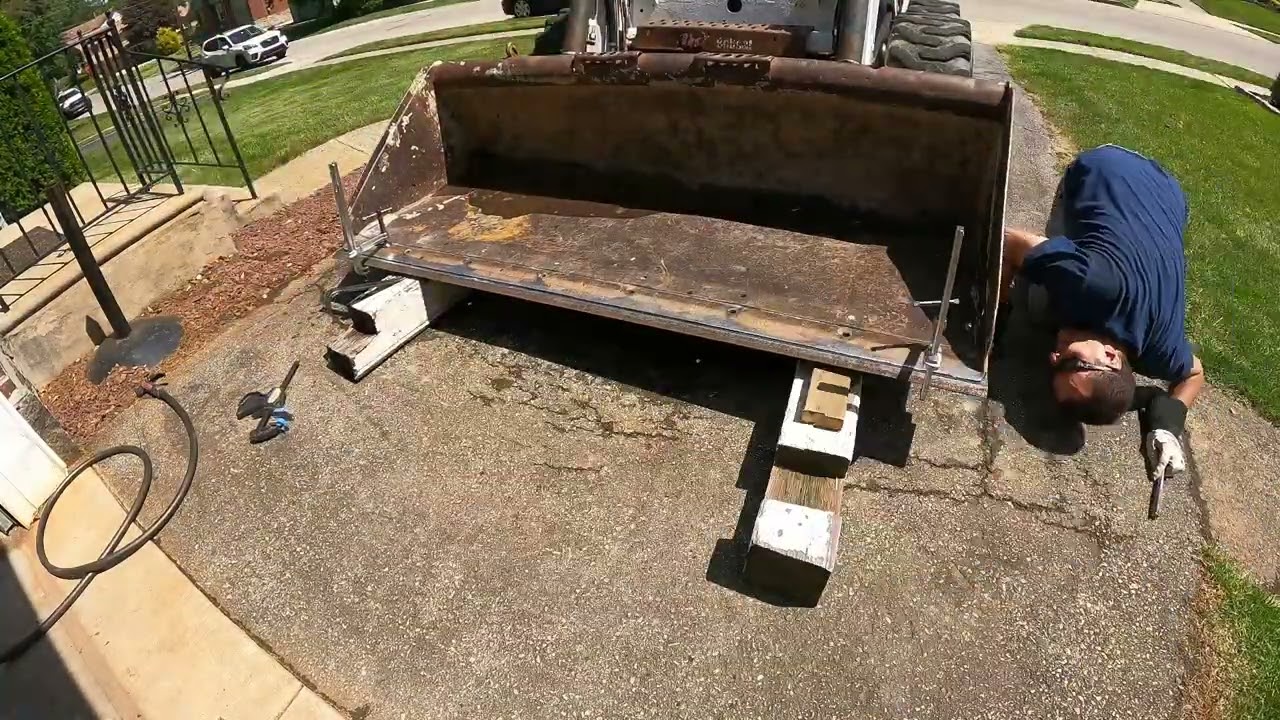 Welding a cutting edge on a Skidsteer Bucket