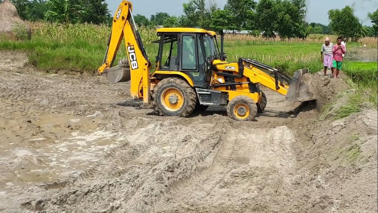 JCB Backhoe Leveling Field  Working In Flood Hit Area