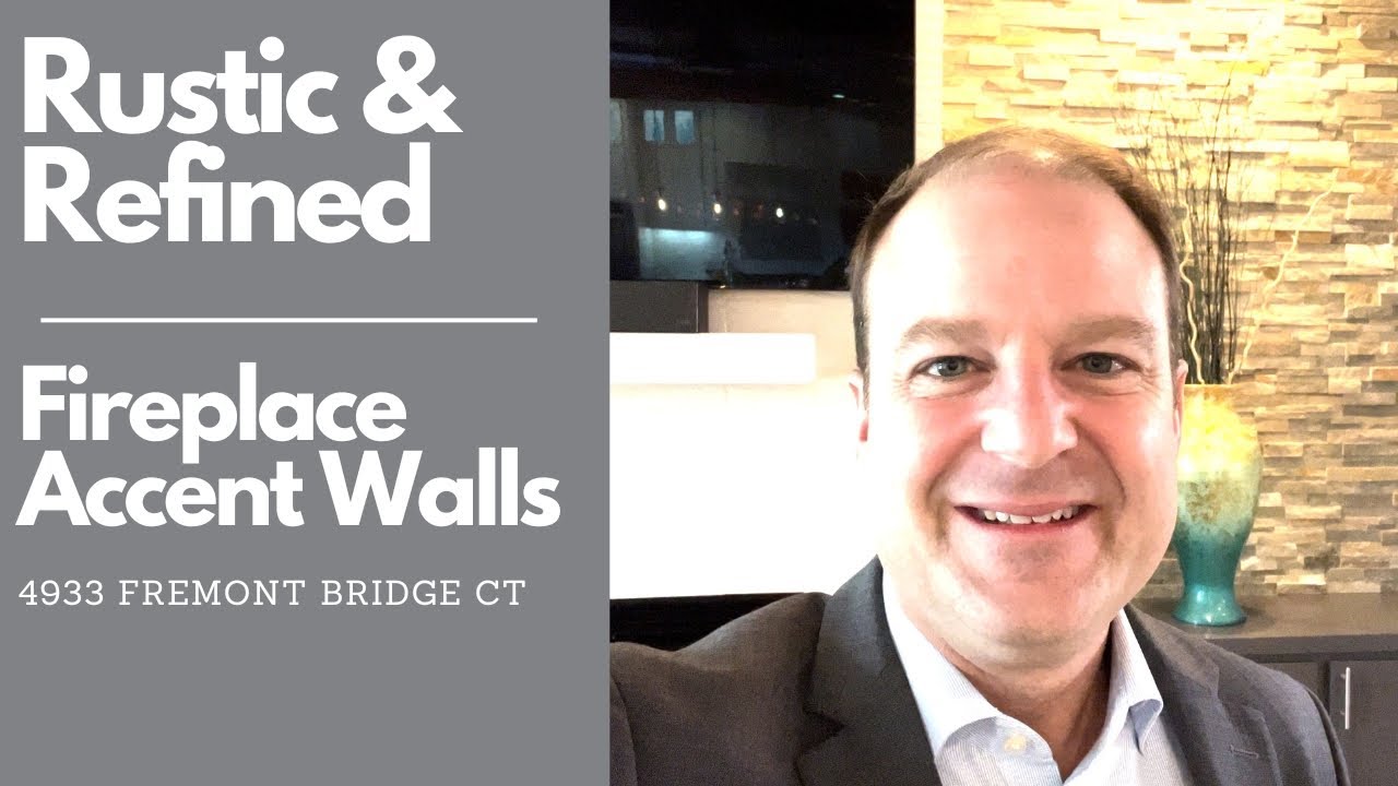 Edmond Homes for Sale in Twin Bridges with stacked stone accent walls at the fireplace