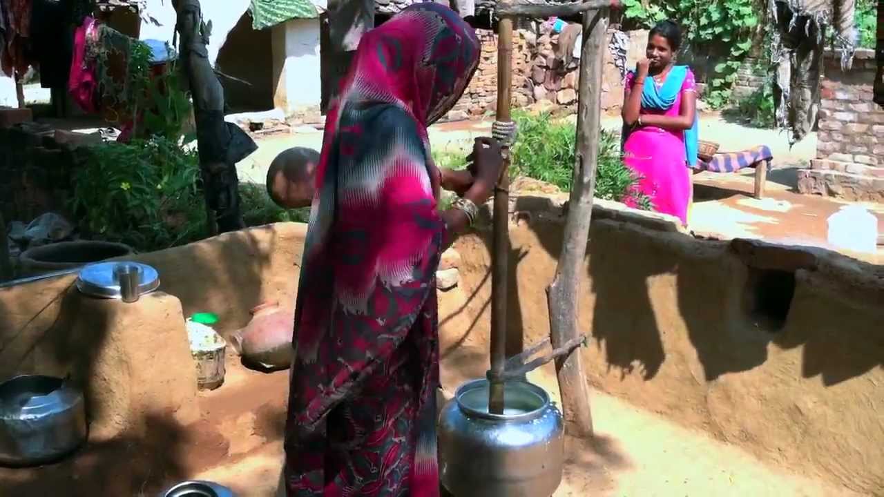 Village Woman Churning Butter