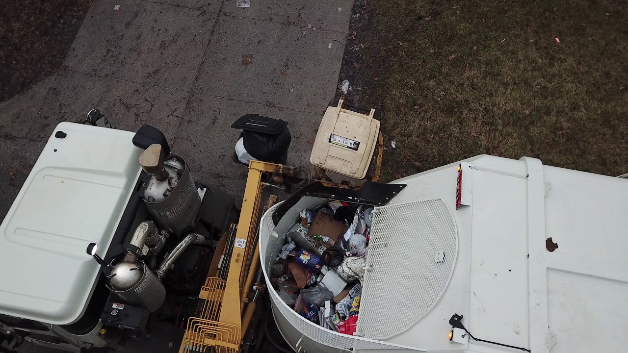 Got Heavy Garbage Cans? Then Get A Heil Rapid Rail Garbage Truck