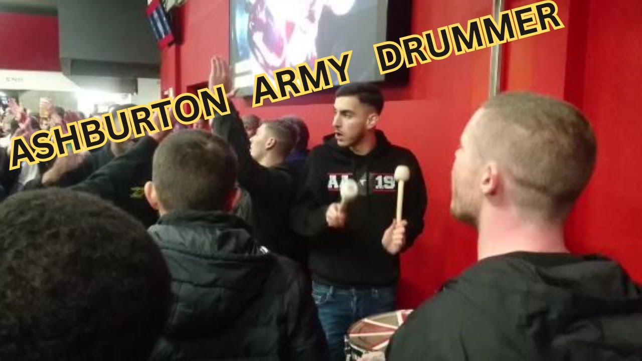Arsenal fans Ashburton Army Drummer playing. on the concourse before game against Nottingham Forest