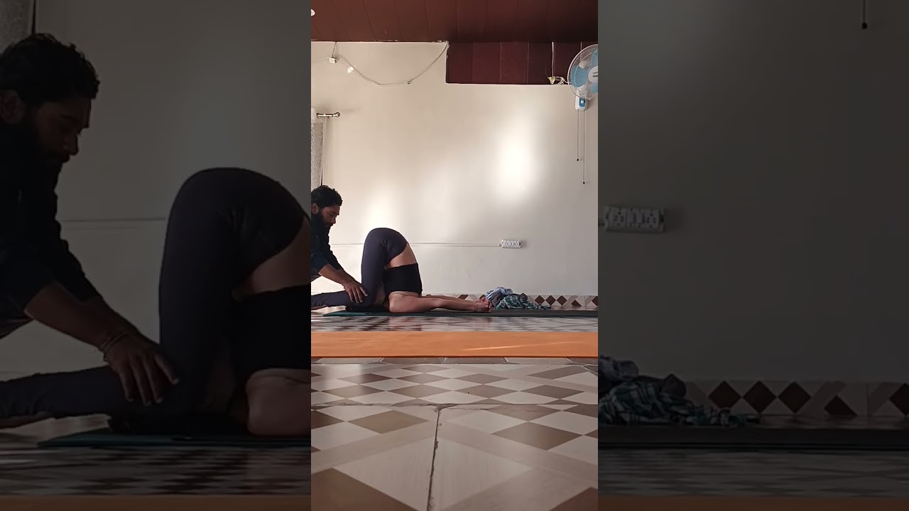 "Practice of karnapidasana" 