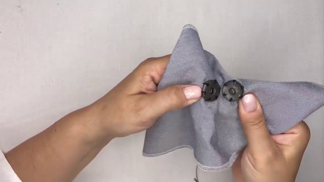 Come attaccare un bottone automatico