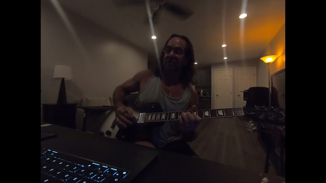 Working on playing Metallica’s “Seek & Destroy” on guitar.
