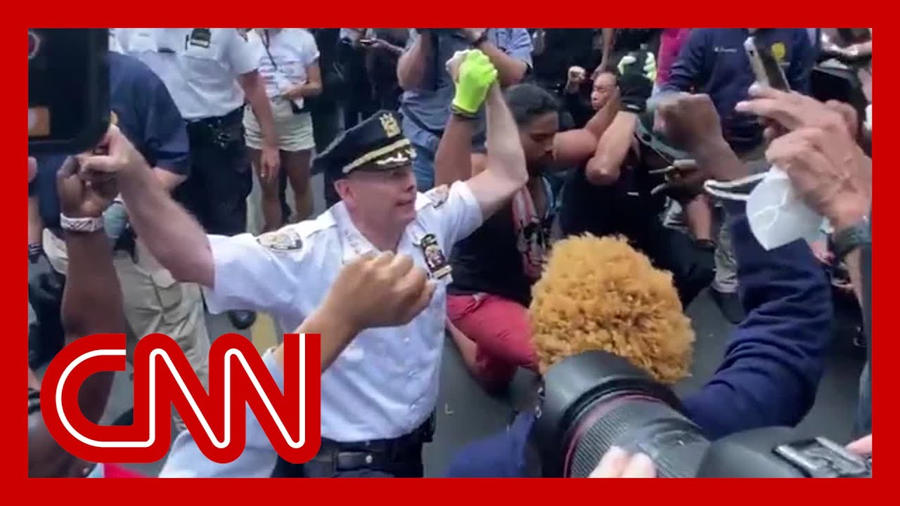 NYPD chief takes a knee with George Floyd protesters