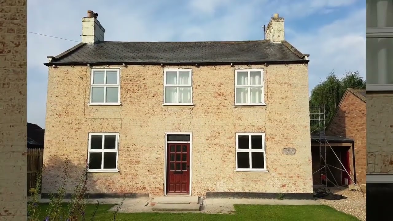 Removing the render from a damp house.
