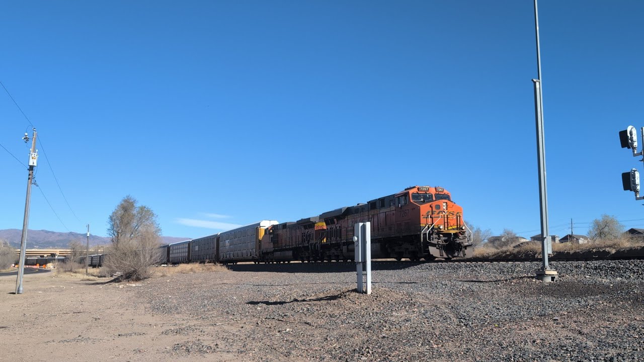 BNSF 7267 leads a long 110 car Autorack train with a hornshow