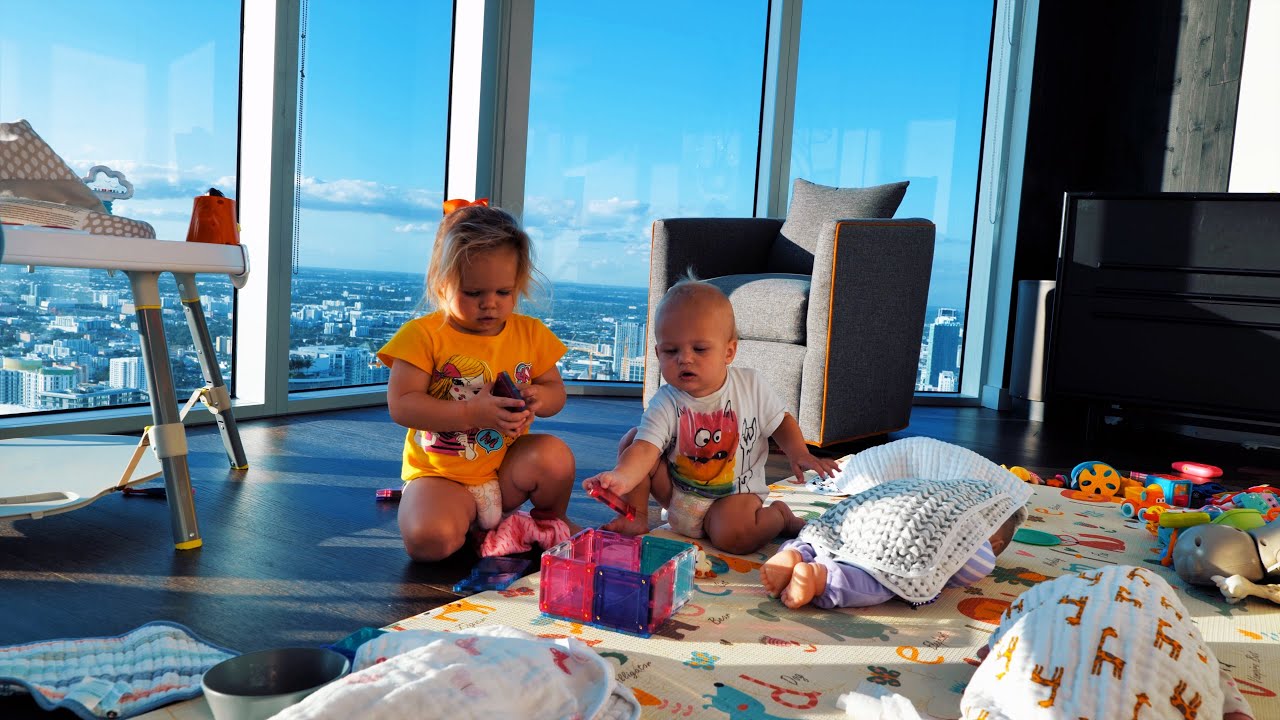 Naomi and David play at home.