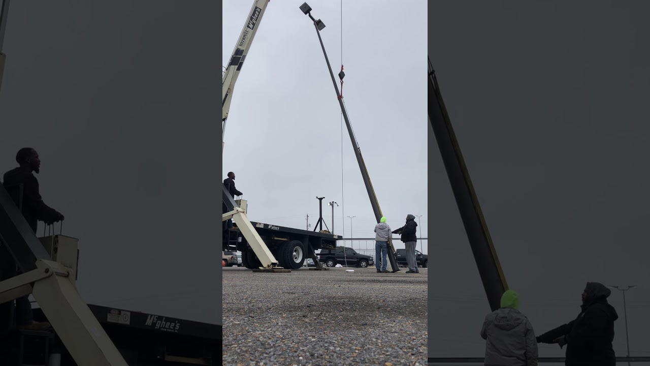 Light pole installation boom truck