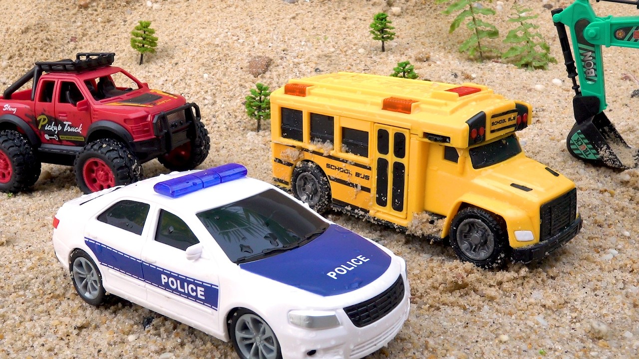 Police cars help the bus escape the sand pit