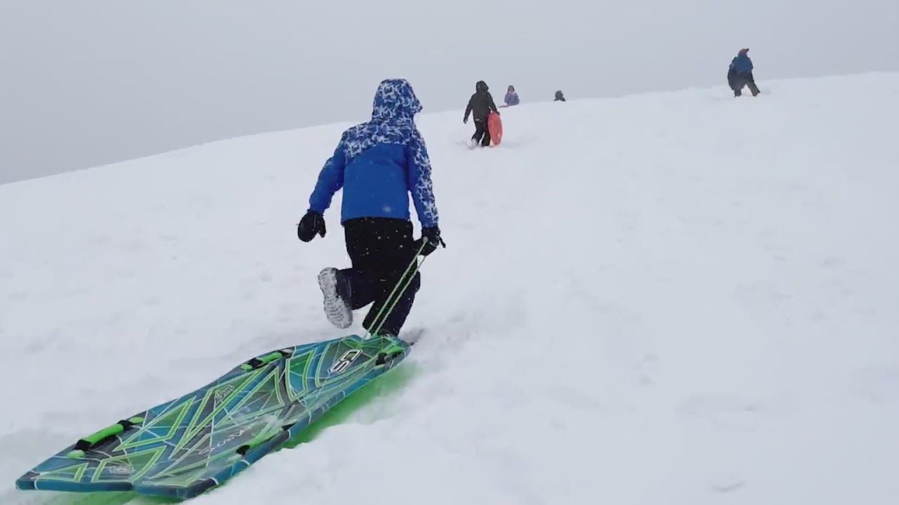 Johnson County families hit the hills for sledding fun