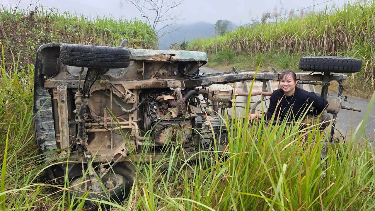 The girl rescued the overturned car and repaired and restored the car's engine.