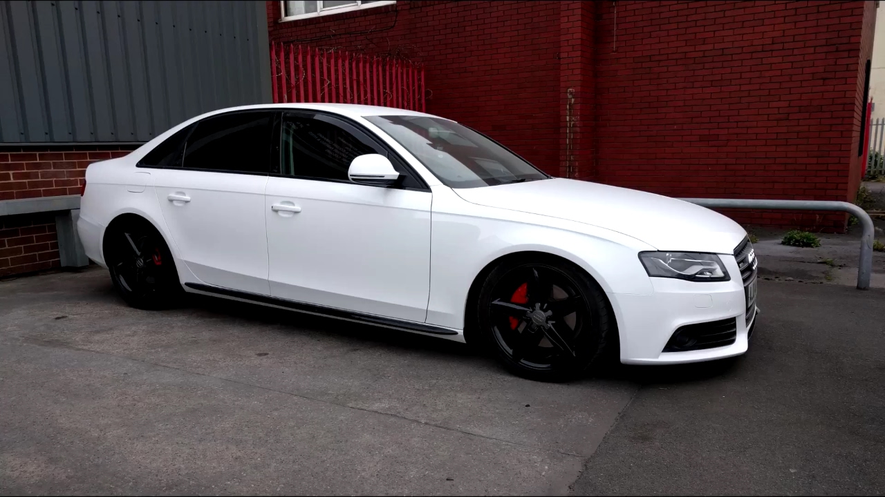 Audi A4 full vinyl wrap with door shuts in gloss white