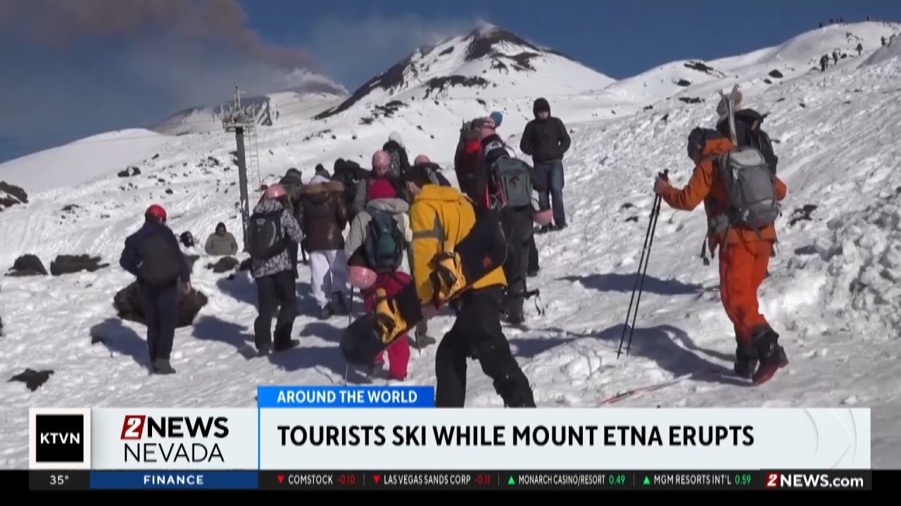 People hit the slopes while Mount Etna is actively erupting