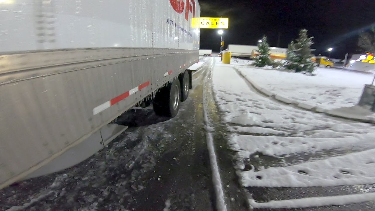 Rookie trucker struggles to slide tandems on ice.  First Winter.