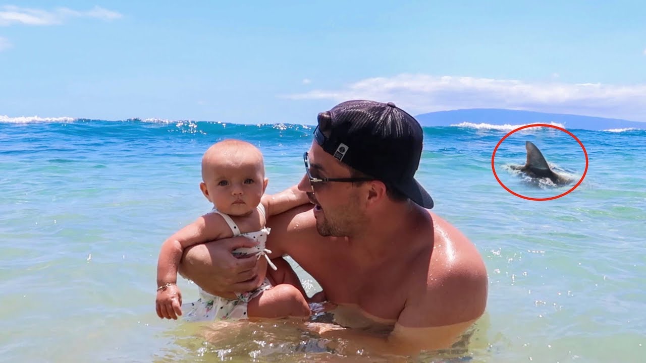 BABYS FIRST TIME IN THE OCEAN