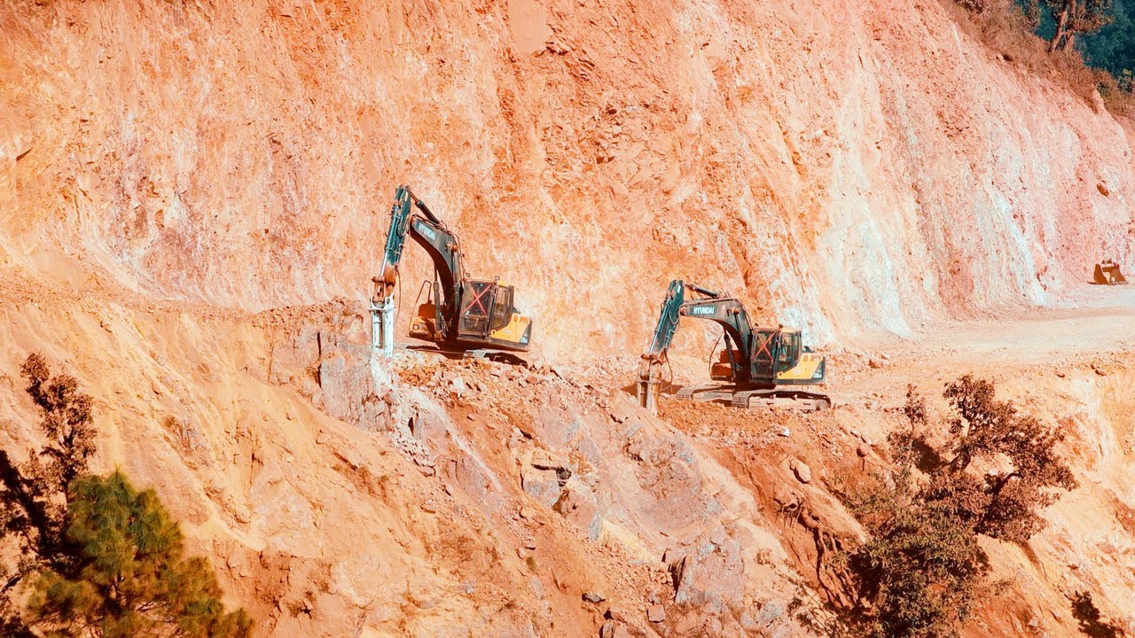 Rock Breaker in Action! Excavator Working on Mountain Road Construction